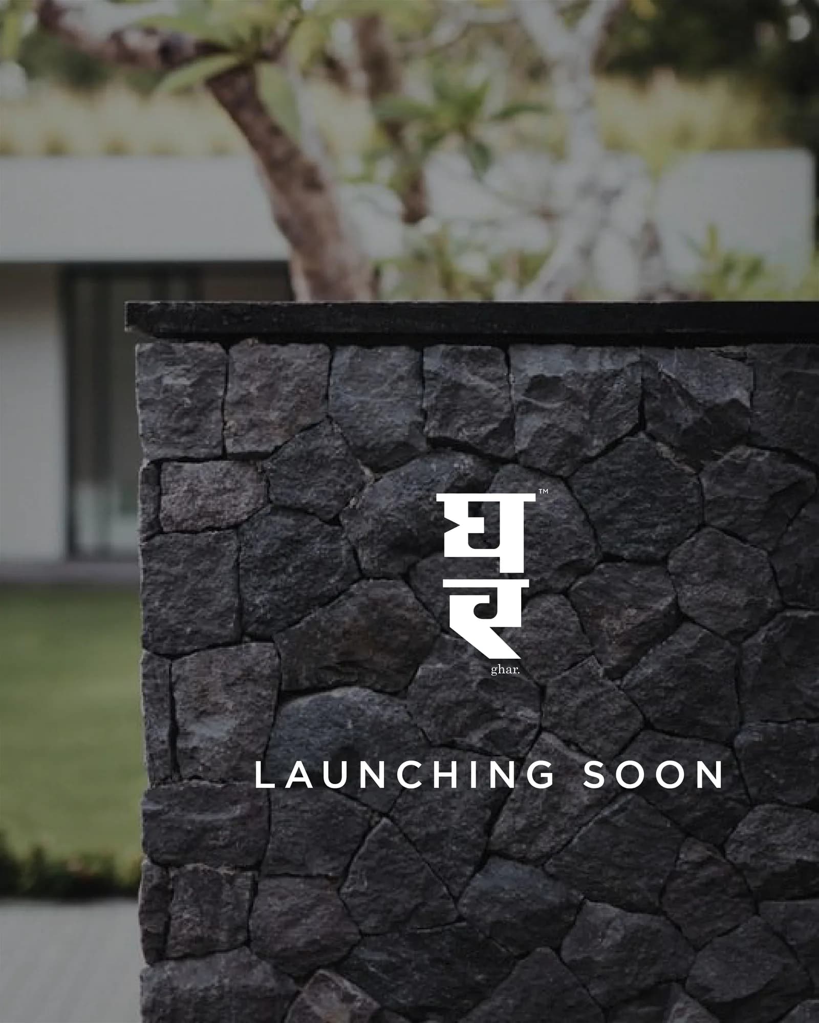 The Ghar logotype set into a stone wall for the launch teaser