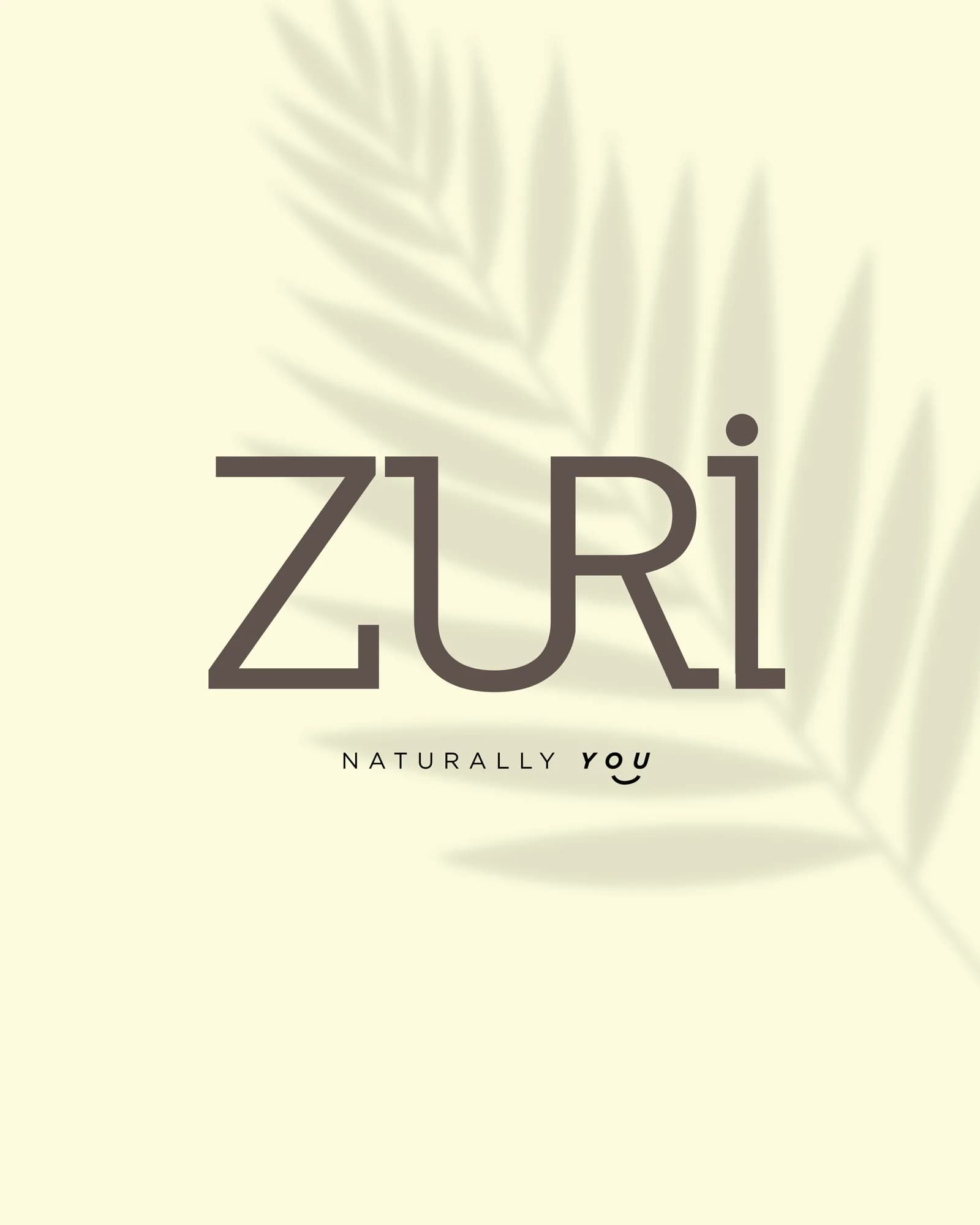 The Zuri wordmark set on a cream ground under palm shadow